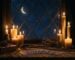 Ciel nocturne etoile et lune vus a travers une ancienne fenetre, quelques bougies au premier plan